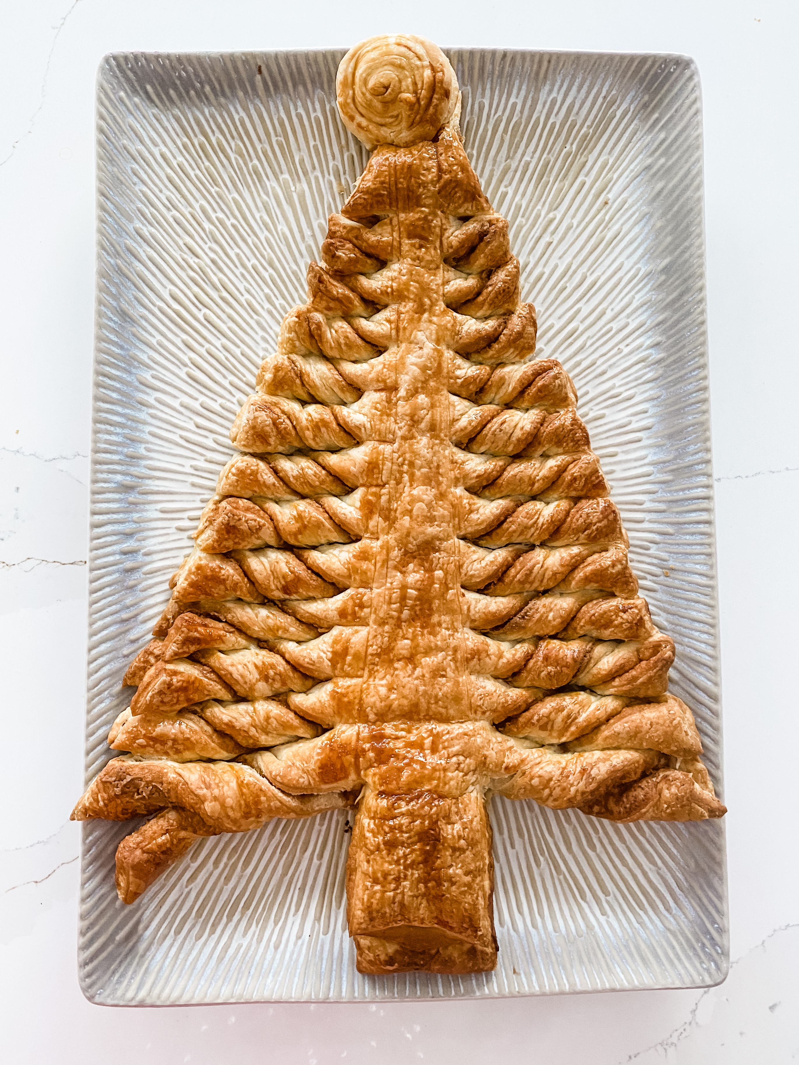 A puff pastry Christmas tree fresh from the oven and perfectly browned