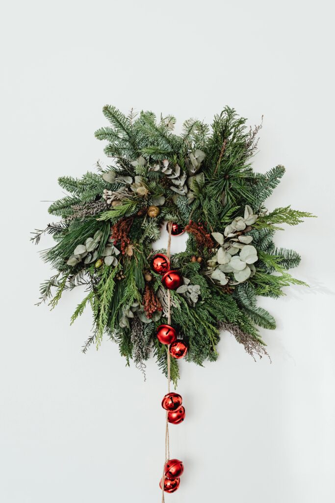 Buy a wreath for all occasions and hang it on a white wall.