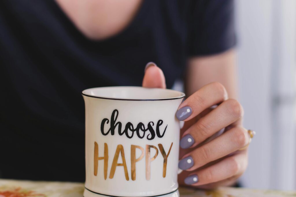 A woman holding a mug that says choose happy, fixing her sleep cycle.
