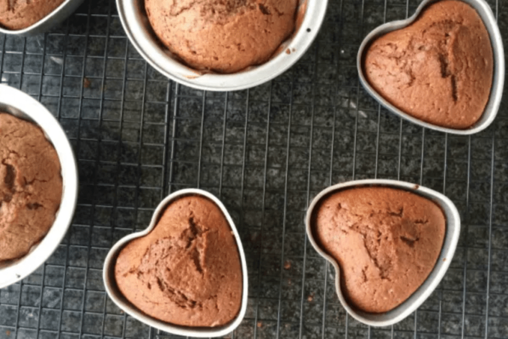 Heart shaped chocolate cakes on a cooling rack